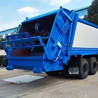 Waste management garbage compactor truck